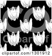 Clipart Of A Seamless Pattern Background Of Ghosts On Black 2 Royalty Free Vector Illustration