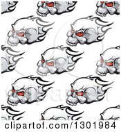 Clipart Of A Seamless Pattern Background Of Red Eyed Skulls And Flames Royalty Free Vector Illustration