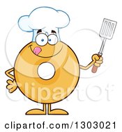Cartoon Round Glazed Or Plain Chef Donut Character Licking His Lips And Holding A Spatula