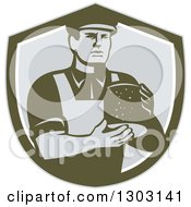 Clipart Of A Retro Male Cheesemaker Holding A Parmesan Round In A Dark Green White And Gray Shield Royalty Free Vector Illustration by patrimonio