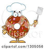 Cartoon Happy Round Chocolate Sprinkled Donut Chef Character Holding A Spatula