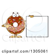 Cartoon Happy Round Chocolate Sprinkled Donut Character Pointing To A Blank Sign