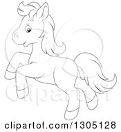 Lineart Clipart Of A Cartoon Black And White Happy Horse Pony Rearing Royalty Free Outline Vector Illustration