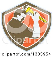 Poster, Art Print Of Retro Male Plumber Bowing And Holding A Monkey Wrench To His Head In A Blue Brown White And Orange Shield