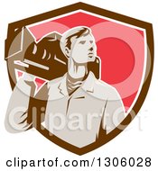 Poster, Art Print Of Retro Male Cameraman Looking To The Side And Emerging From A Brown White And Red Shield