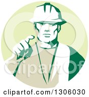 Retro Male Construction Worker Builder Pointing Outwards In A Pastel Green Circle