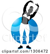 Poster, Art Print Of Silhouetted Posing Black And White Female Bodybuilder Over A Blue Circle