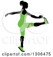 Poster, Art Print Of Black Silhouetted Woman In Green Stretching And Reaching For Her Toes