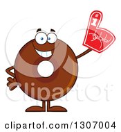 Clipart Of A Cartoon Happy Round Chocolate Donut Character Wearing A Foam Finger Royalty Free Vector Illustration by Hit Toon