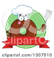 Cartoon Happy Round Chocolate Donut Chef Character Holding A Spatula Over A Blank Banner In A Green Circle