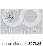 Clipart Of A Football Helmet In A Shield And Gray Rays Background Or Business Card Design Royalty Free Illustration