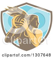 Retro Woodcut Female Volleyball Player Rebounding In A Brown White And Blue Shield