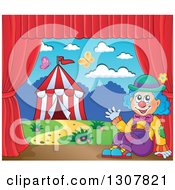 Clown Sitting And Waving Against A Big Top Circus Tent On A Stage