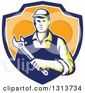 Poster, Art Print Of Retro Male Mechanic Holding A Giant Adjustable Wrench In A Blue White And Orange Shield