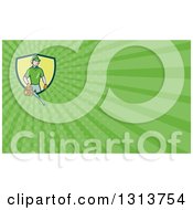 Clipart Of A Cartoon White Male Gardener Using A Leaf Blower And Green Rays Background Or Business Card Design Royalty Free Illustration