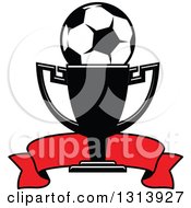 Clipart Of A Soccer Ball In A Championship Trophy Cup With A Red Banner Royalty Free Vector Illustration