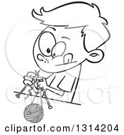 Cartoon Black And White Boy Knitting With A Ball Of Yarn And Needles
