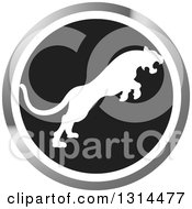 Clipart Of A White Silhouetted Leaping Cougar Or Tiger In A Black White And Silver Circle Royalty Free Vector Illustration