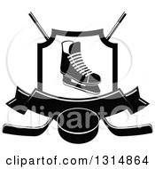Black And White Ice Skate In A Shield Over Crossed Hockey Sticks A Banner And Puck