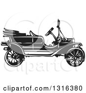 Clipart Of A Black And White Woodcut Antique Model T Car Royalty Free Vector Illustration by xunantunich #COLLC1316380-0119