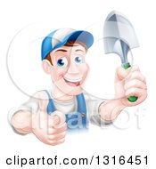 Poster, Art Print Of Brunette White Male Gardener In Blue Holding Up A Shovel And Giving A Thumb Up