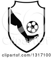 Black And White Soccer Ball Players Foot Kicking A Ball In A Shield