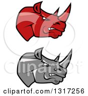 Clipart Of Cartoon Angry Red And Gray Rhinoceros Heads In Profile 2 Royalty Free Vector Illustration