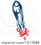Clipart Of A Retro Blue Rocket With Red Flames 5 Royalty Free Vector Illustration