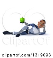 Clipart Of A 3d Young Black Male Super Hero Dark Blue Suit Resting On His Side And Holding A Green Apple Royalty Free Illustration