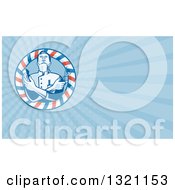 Clipart Of A Retro Woodcut Barber With Crossed Arms Holding Clippers And Scissors In A Pole Frame And Blue Rays Background Or Business Card Design Royalty Free Illustration