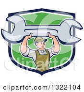 Clipart Of A Cartoon White Male Mechanic Holding Up A Giant Spanner Wrench And Emerging From A Blue White And Green Shield Royalty Free Vector Illustration