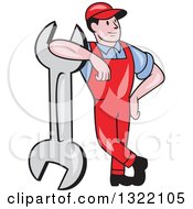 Cartoon White Male Mechanic Leaning On A Giant Spanner Wrench