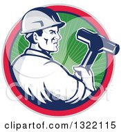 Retro Male Construction Worker Holding A Sledgehammer In A Green Ray Blue Pink And Gray Circle