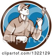Poster, Art Print Of Retro Male Worker Holding A Hdmi Cable And Emerging From A Brown White And Blue Circle