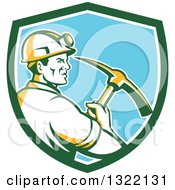 Clipart Of A Retro Male Coal Miner Holding A Pickaxe In A Green White And Blue Shield Royalty Free Vector Illustration by patrimonio