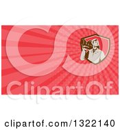 Clipart Of A Retro Male Cameraman Looking To The Side And Red And Pink Rays Background Or Business Card Design Royalty Free Illustration