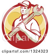 Clipart Of A Retro Male Mechanic Holding A Wrench And Emerging From A Red White And Yellow Circle Royalty Free Vector Illustration