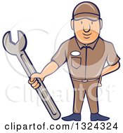 Clipart Of A Cartoon White Male Mechanic Holding A Wrench Royalty Free Vector Illustration