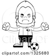 Lineart Clipart Of A Cartoon Blcak And White Mad Bigfoot Soccer Player Royalty Free Outline Vector Illustration