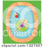 Happy Blond Girl Floating In An Inner Tube In A Swimming Pool