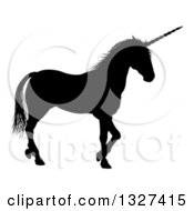 Poster, Art Print Of Black Silhouetted Unicorn In Profile Walking To The Right
