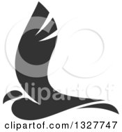 Clipart Of A Grayscale Flying Bird Royalty Free Vector Illustration