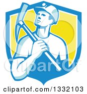 Retro Male Coal Miner Holding A Pickaxe In A Blue White And Yellow Shield