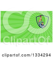 Clipart Of A Retro Male Plumber Holding Up A Monkey Wrench And Green Rays Background Or Business Card Design Royalty Free Illustration