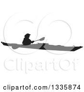 Clipart Of A Black Silhouetted Man Kayaking Royalty Free Vector Illustration