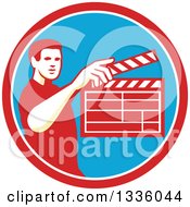 Poster, Art Print Of Retro Male Movie Director Holding Up A Clapperboard In A Red White And Blue Circle