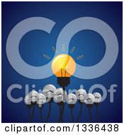 Poster, Art Print Of Shining Idea Light Bulb With Plain Ones Below Over Blue