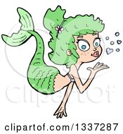 Clipart Of A Cartoon Green White Mermaid Blowing A Kiss Royalty Free Vector Illustration