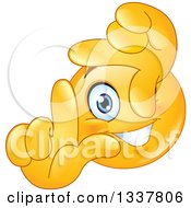 Cartoon Yellow Smiley Face Emoticon Framing A Scene With His Fingers