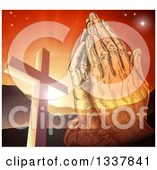 Engraved Praying Hands Over A Christian Cross Orange Sunset And Mountains